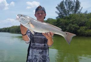 Kid Fishing Redfish 2 Tampa Bay Fishing Charter Capt. Matt Santiago