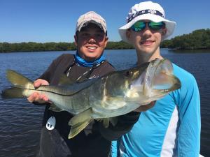 Kid Fishing Snook 5 Tampa Bay Fishing Charter Capt. Matt Santiago